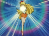 Sailor Venus performing Venus Crescent Beam Smash attack from the Sailor Moon anime series.