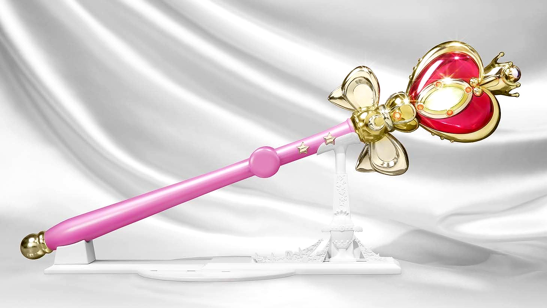 Sailor Moon Tamashii Nations Spiral Moon Heart Rod Proplica wand on a white Moon Kingdom display stand.